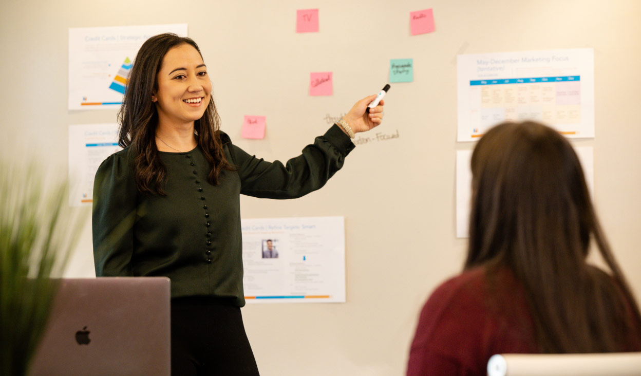 An employee giving attention to explaining the strategy to a customer